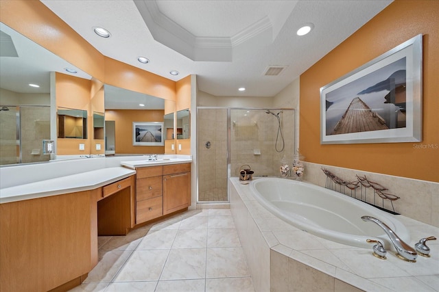 bathroom featuring tile patterned flooring, separate shower and tub, a textured ceiling, vanity, and ornamental molding