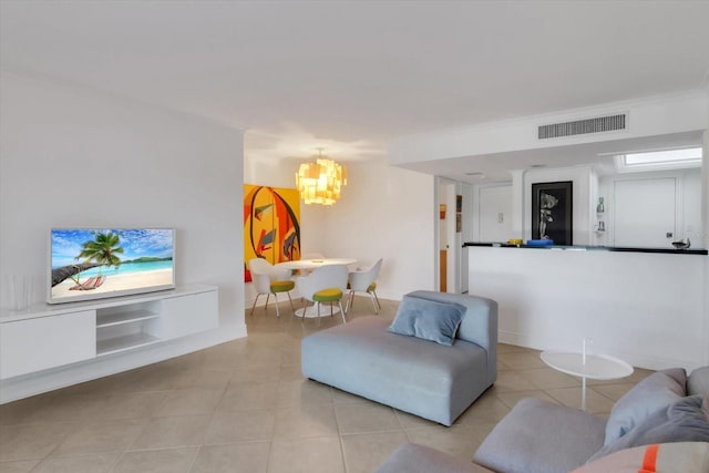 living room featuring light tile patterned floors and an inviting chandelier