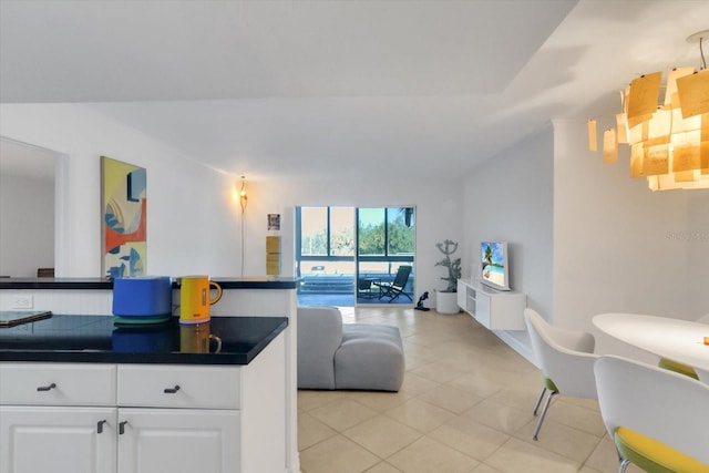 kitchen with white cabinetry and light tile patterned floors