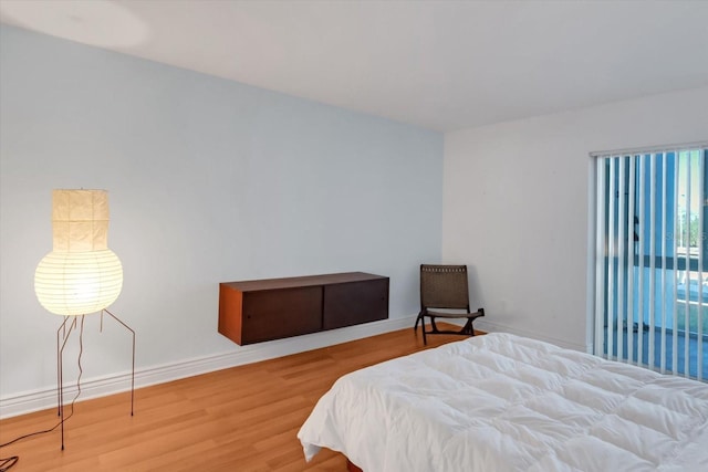 bedroom with hardwood / wood-style flooring