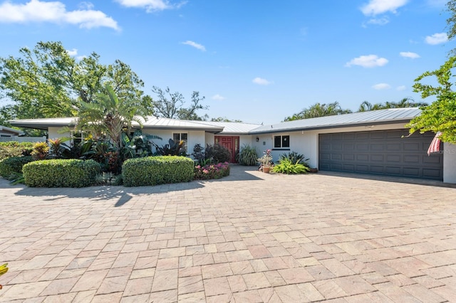 single story home featuring a garage