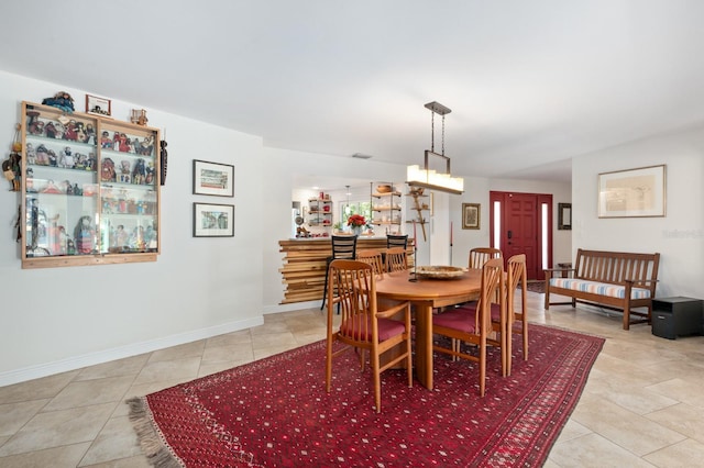 dining space with light tile patterned floors