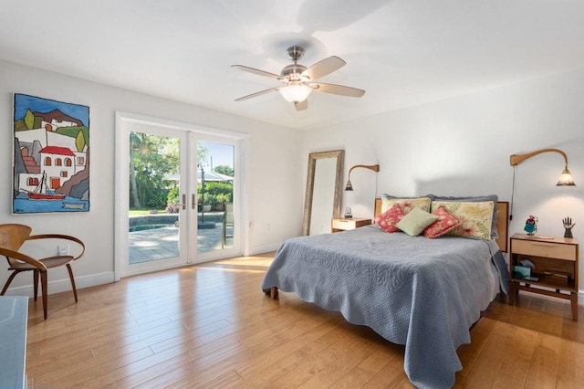 bedroom with light wood-type flooring, access to outside, and ceiling fan