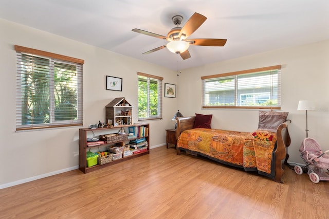 bedroom featuring light hardwood / wood-style floors and ceiling fan