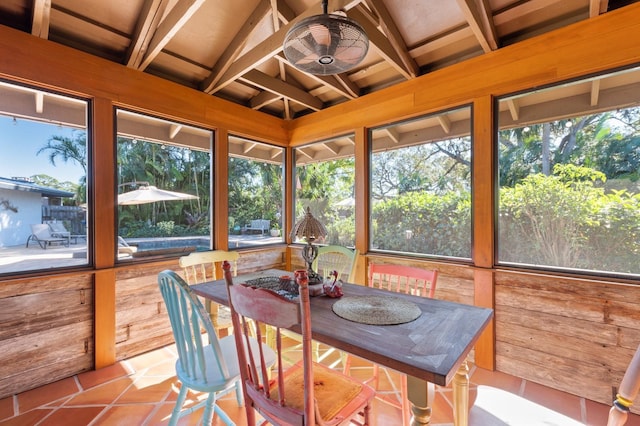 sunroom featuring lofted ceiling