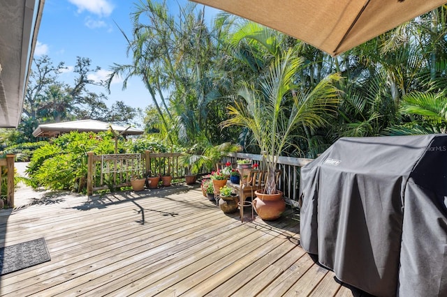 wooden terrace with area for grilling