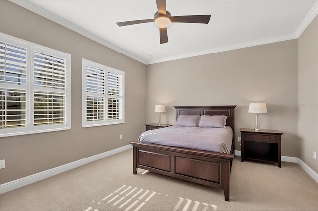 carpeted bedroom with ceiling fan and crown molding