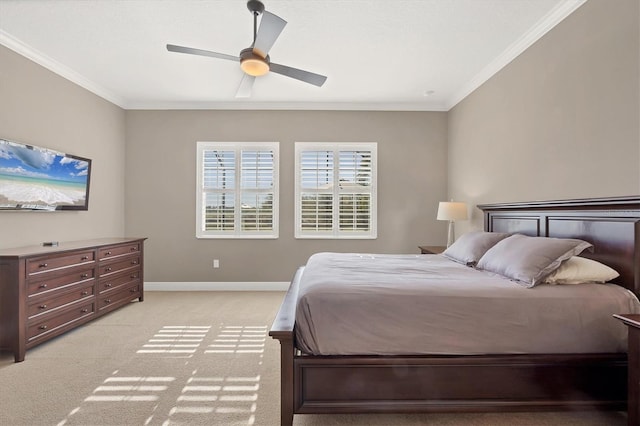 carpeted bedroom featuring ceiling fan and ornamental molding