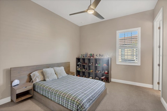 bedroom featuring ceiling fan and light carpet