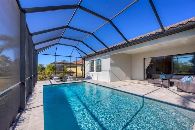 view of pool featuring a lanai, an outdoor hangout area, and a patio