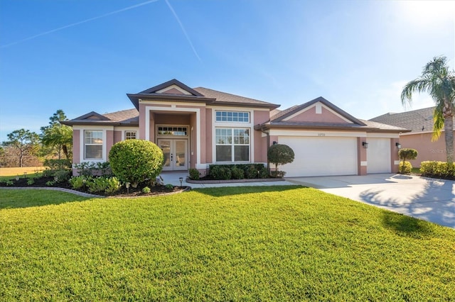 view of front of property featuring a front lawn, a garage, and french doors