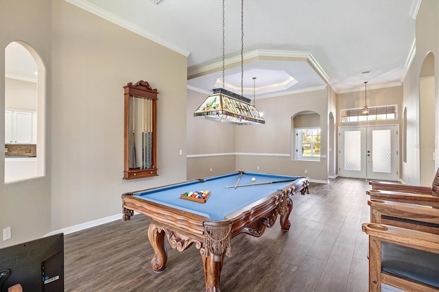 recreation room featuring dark hardwood / wood-style flooring, french doors, ornamental molding, and billiards