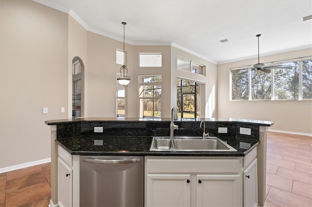 kitchen featuring dishwasher, white cabinets, a center island with sink, and sink