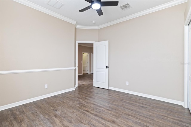 unfurnished room featuring crown molding, ceiling fan, and dark wood-type flooring