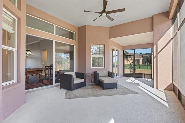 interior space featuring ceiling fan and pool table