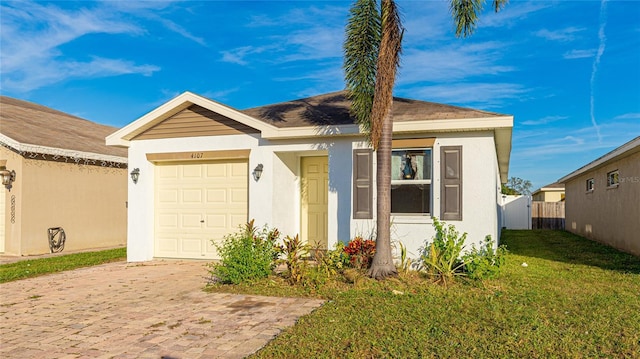 view of front of home featuring a garage and a front lawn