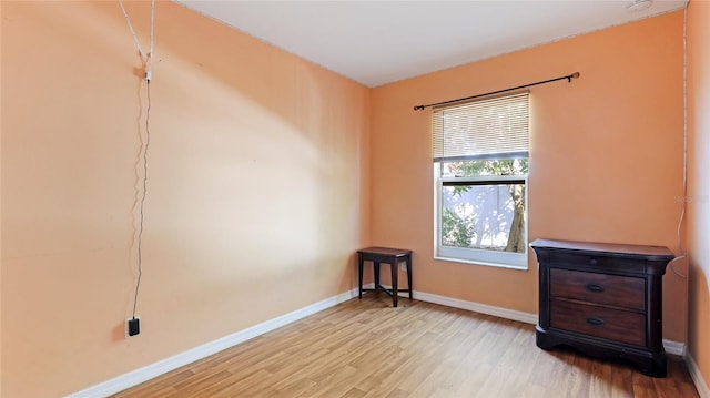 unfurnished room featuring light hardwood / wood-style floors