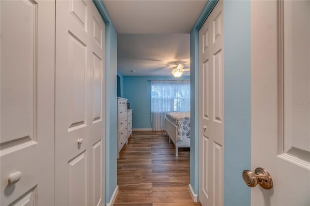 corridor featuring hardwood / wood-style floors