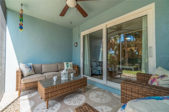 sunroom / solarium featuring ceiling fan