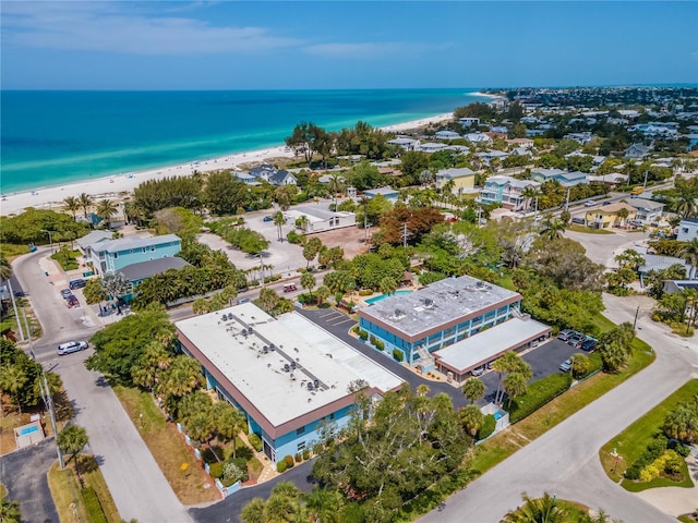 birds eye view of property featuring a view of the beach and a water view