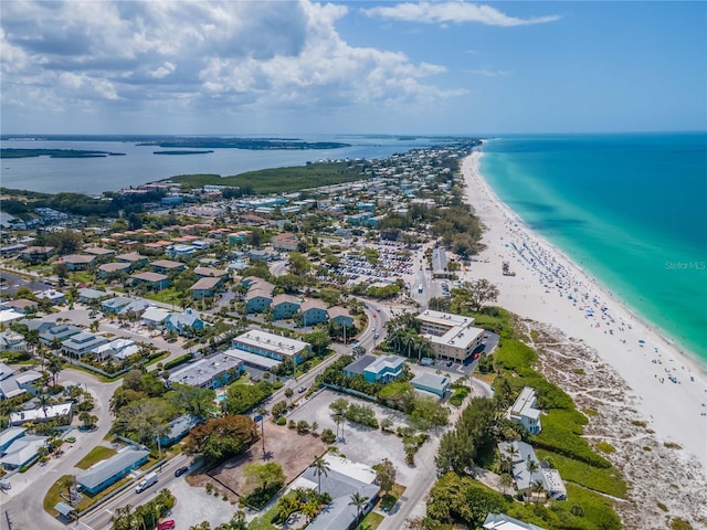 bird's eye view featuring a water view and a beach view