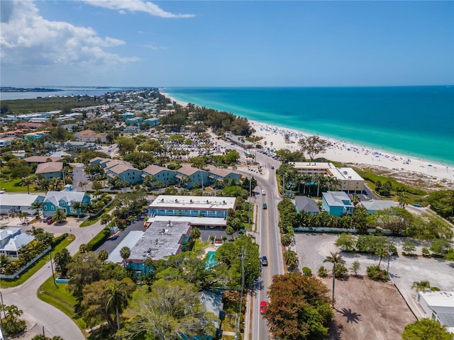 bird's eye view with a beach view and a water view