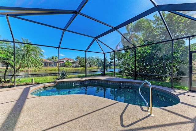 pool with a lanai, a water view, and a patio area