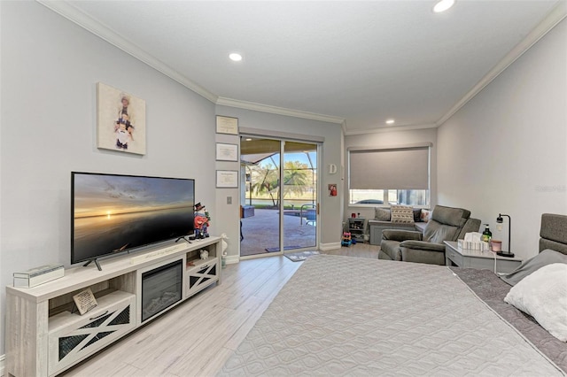 bedroom with access to exterior, crown molding, light wood-type flooring, baseboards, and recessed lighting