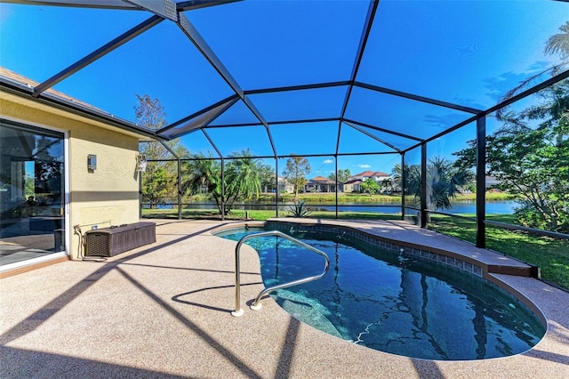 pool featuring glass enclosure, a water view, and a patio area