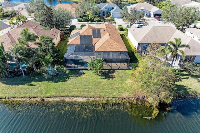 drone / aerial view with a residential view and a water view