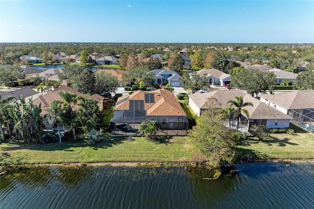 bird's eye view featuring a residential view and a water view