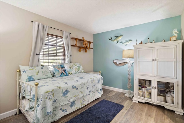 bedroom with hardwood / wood-style flooring