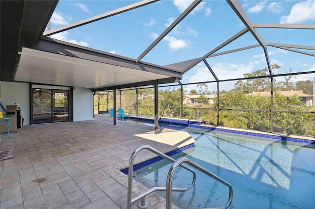 view of swimming pool featuring a lanai and a patio