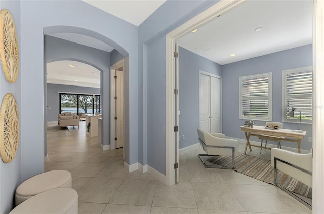 corridor featuring light tile patterned flooring