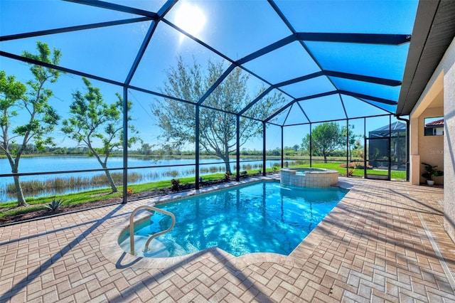 view of pool featuring a lanai, a patio area, an in ground hot tub, and a water view