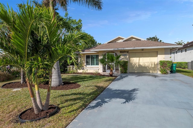 view of front of home featuring a front yard, a garage, and central AC unit