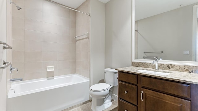 full bathroom featuring vanity, toilet, and tiled shower / bath