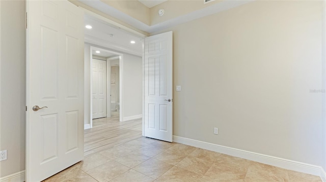 unfurnished room featuring baseboards, recessed lighting, light tile patterned flooring, and a smoke detector