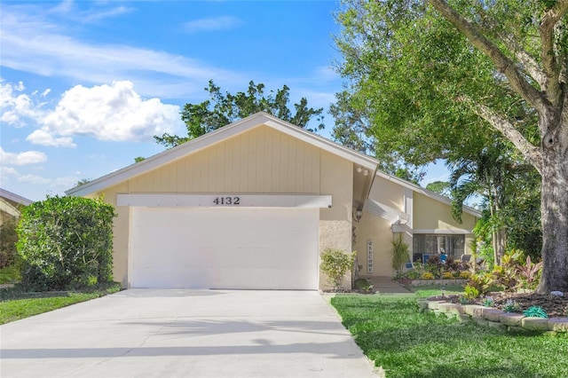 ranch-style home featuring a garage