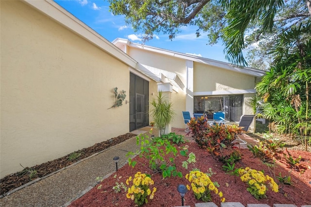 doorway to property with a patio area