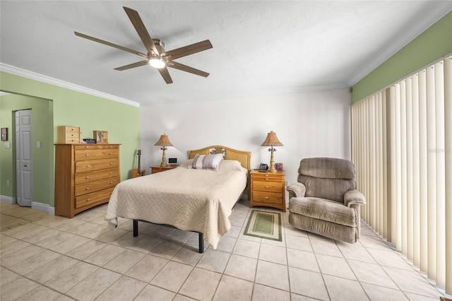 tiled bedroom featuring ceiling fan and crown molding