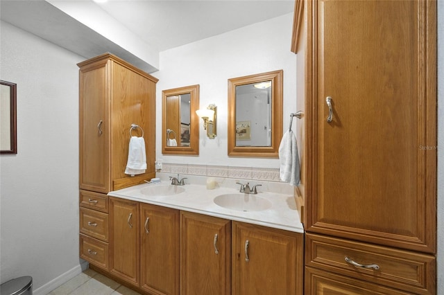 bathroom featuring tile patterned flooring and vanity