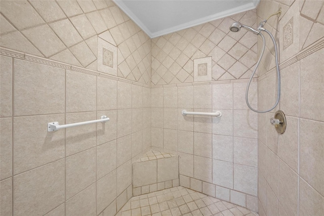 bathroom with a tile shower and ornamental molding