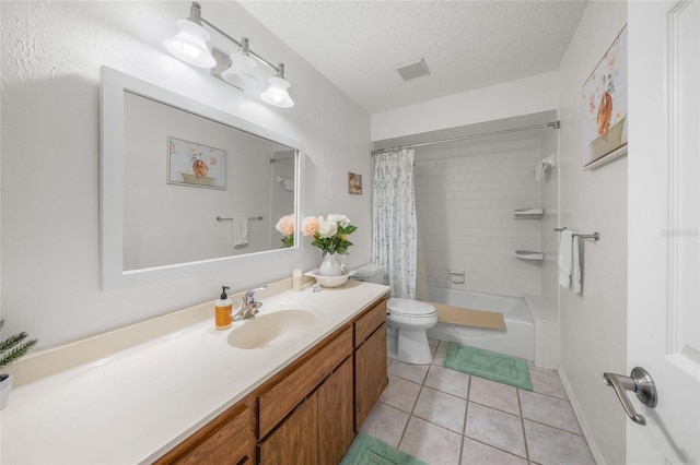 full bathroom with vanity, tile patterned flooring, toilet, shower / bath combo with shower curtain, and a textured ceiling