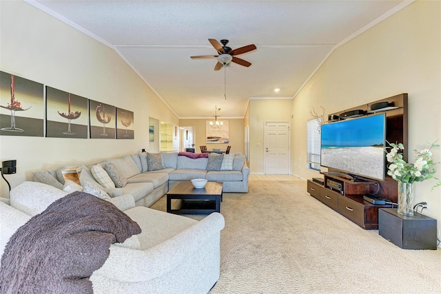 carpeted living room with ceiling fan with notable chandelier, lofted ceiling, and crown molding