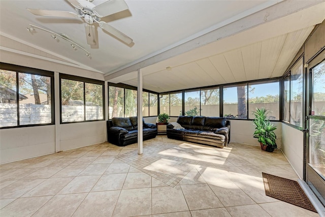 sunroom / solarium featuring ceiling fan, plenty of natural light, and lofted ceiling