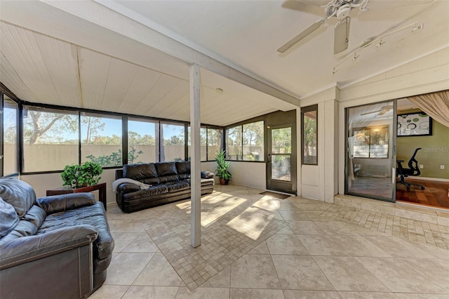 sunroom with plenty of natural light, ceiling fan, and lofted ceiling