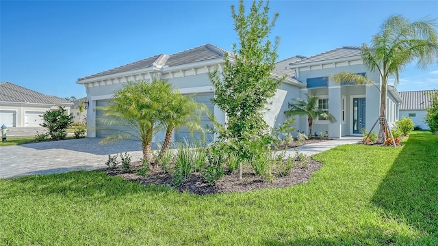 view of front facade with a front yard and a garage