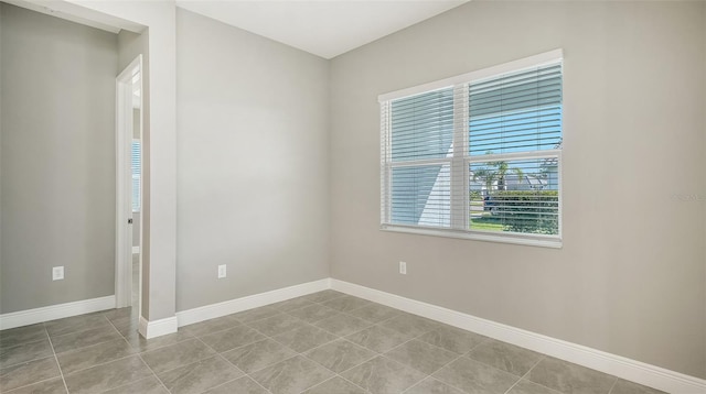 unfurnished room with light tile patterned floors