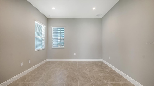 spare room with light tile patterned floors